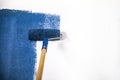 Raint roller with blue paint Royalty Free Stock Photo