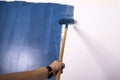 Raint roller with blue paint Royalty Free Stock Photo