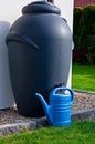 Rainwater barrel downspout modern design house exterior Royalty Free Stock Photo