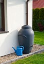 Rainwater barrel downspout modern design house exterior Royalty Free Stock Photo