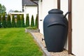 Rainwater barrel downspout modern design house exterior Royalty Free Stock Photo