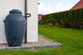 Rainwater barrel downspout modern design house exterior Royalty Free Stock Photo