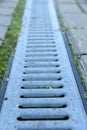 Rainwater drainage canal or tray with metall mesh capor grate