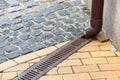 A rainwater drainage pipe system under a pedestrian pavement.