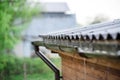 Rainwater drains off the roof.