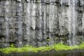 rainwater trickling down a limestone wall