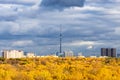 Rainy clouds in blue sky over city with TV tower Royalty Free Stock Photo
