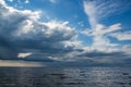 Rainy dark clouds during at sunset at Baltic sea.