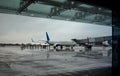 Rainy day airport. View from the lounge`s glass windows. Royalty Free Stock Photo