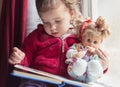 A rainy day is best for reading with your favorite doll