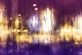 Rainy Day in City Concept. Raindrops on Glass Window. Blurred Urban Lights as Outside View Royalty Free Stock Photo