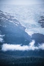 Rainy day and fog over alaskan mountain glaciers