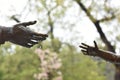 Rainy Day Hands Adult and Child Reaching Towards Each Other