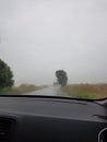 rainy day with heavy clouds driving car and watching