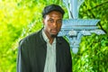 Portrait of Young black man in park in rainy day in New York City Royalty Free Stock Photo