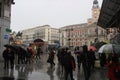 Rainy day in Madrid, capital of Spain. Walking street with pedestrians. rain umbrella Royalty Free Stock Photo