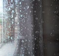 Raindrops On A Window Pane. Drops Of Water On A Metal Surface, On A Window Pane, Window In A House In Rainy Time