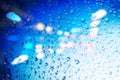 Raindrops on a blurred multicolored bokeh background Royalty Free Stock Photo