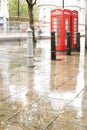 Rainy day.Red Phone cabines in London