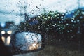 Rainy day on the road, Raindrops on car mirror with side wing mirror Royalty Free Stock Photo