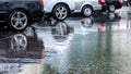 Rainy day on streets. parked cars under heavy rain with refl Royalty Free Stock Photo