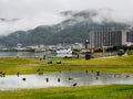 Rainy day at Suwa Lakeside Park with heavy clouds covering the mountains around Lake Suwako