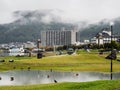 Rainy day at Suwa Lakeside Park with heavy clouds covering the mountains around Lake Suwako