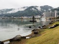 Rainy day at Suwa Lakeside Park with heavy clouds covering the mountains around Lake Suwako