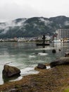 Rainy day at Suwa Lakeside Park with heavy clouds covering the mountains around Lake Suwako