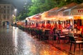 Rainy evening with people sitting at terraces market square Krakow Royalty Free Stock Photo