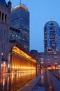 A rainy evening reflects the lights of the Boston skyline