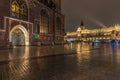 Rainy evening view market square Polish Krakow and Sukiennice passage Royalty Free Stock Photo