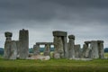 A rainy morning at the Stonehenge prehistoric site with dark clouds