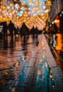 Rainy night in a big city, reflections of lights on the wet road surface. Royalty Free Stock Photo