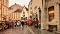 Rainy old town of Tallinn ,Estonia 20,08,2019 people walk with umbrellas holiday tourist urban city lifestyle travel to Baltic