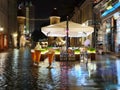 Rainy season Autumn  street  cafe  old town of tallinn panorama blurring bokeh city light people walkeople walking under rainy sky Royalty Free Stock Photo