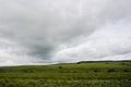 Rainy sky clouds over agricultural rural landscape Royalty Free Stock Photo