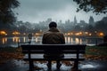 Rainy solitude person sits on bench, contemplating cityscape in rainfall