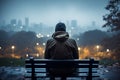 Rainy solitude person sits on bench, contemplating cityscape in rainfall