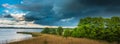 Rainy storm clouds approaching the pond Royalty Free Stock Photo