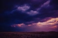 rainy storm cloudy thunderstorm background sky dramatic colorful clouds sky blue violet purple dark Royalty Free Stock Photo