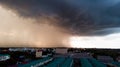 Rainy storm with grain over the city. Dark sky and dramatic cloud before rain in rainy season. Royalty Free Stock Photo