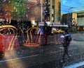 Rainy street people walk cafe table and chair in window vitrines reflection city lifestyle  Autumn season Royalty Free Stock Photo