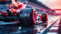 Rainy training. Close-up of red racing car wheel moving on high speed on wet race track with blurred tribune on Royalty Free Stock Photo