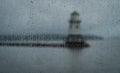 rainy view through window of lighthouse