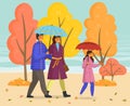 Rainy weather, father, mother, daughter with umbrella walking in autumn park together, enjoy nature Royalty Free Stock Photo