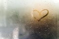 Rainy weather, the inscription heart on the sweaty glass