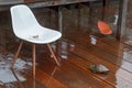 Rainy Wooden Deck with Wet Chair and Turtle Exploring Royalty Free Stock Photo