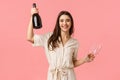 Raise your glasses ladies. Carefree happy young woman celebrating bachelorette party, holding champagne bottle and glass Royalty Free Stock Photo