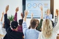 Raise your hands for learning opportunites. a group of businesspeople raising their hands in a class. Royalty Free Stock Photo